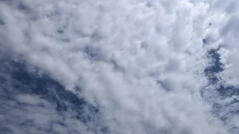 Dramatic Sky: Clouds Shifting Across Deep Blue Canvas, a heavenly view Stock Photos