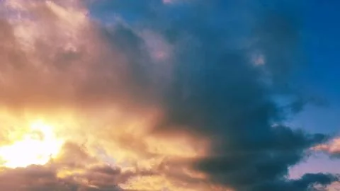 Dramatic sky with clouds at sunset, with a gradient of colors and textures Stock Photos