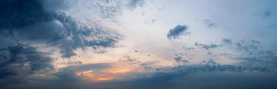 Dramatic sky with clouds at sunset. Stock Photos