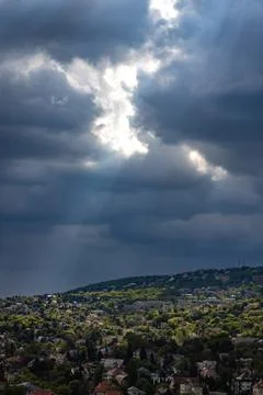 Dramatic sky with dark clouds and sunbeams Stock Photos