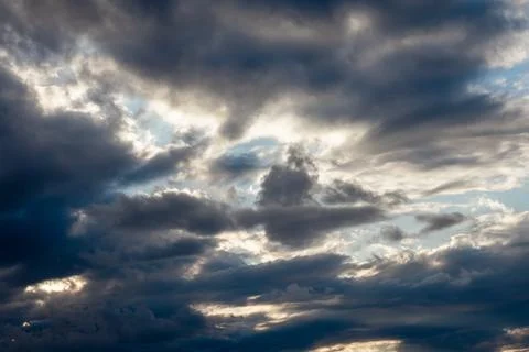Dramatic Sky with Dark Clouds and Sunlight Фото