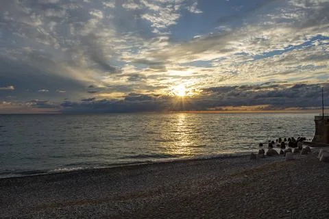 Dramatic sky with dark clouds on calm sea at sunset. Black Sea coast, early.. Stock-Fotos