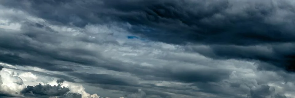 Dramatic sky with dark clouds. Dark rain clouds Stock Photos