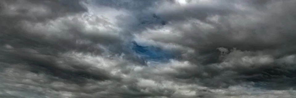 Dramatic sky with dark clouds. Dark rain clouds Stock Photos