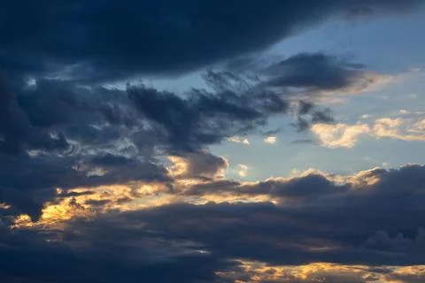 Dramatic Sky With Dark Clouds At Sunset Stock Photos