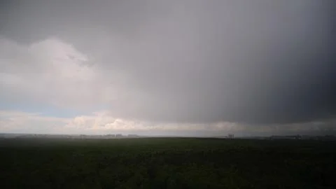 Dramatic sky with dark rain clouds on a hot summer day Stock Photos