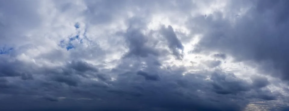 Dramatic sky with dark rainy clouds before the storm. Weather forecast concep Stock Photos