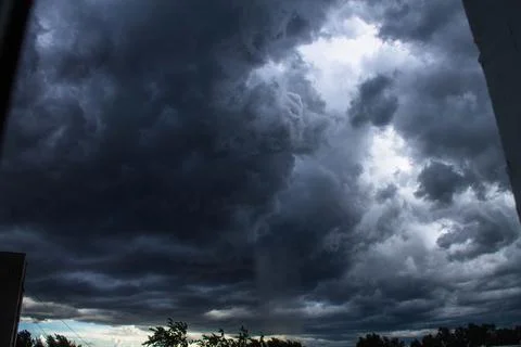 Dramatic sky with dark storm clouds, thunderstorm clouds Stock Photos