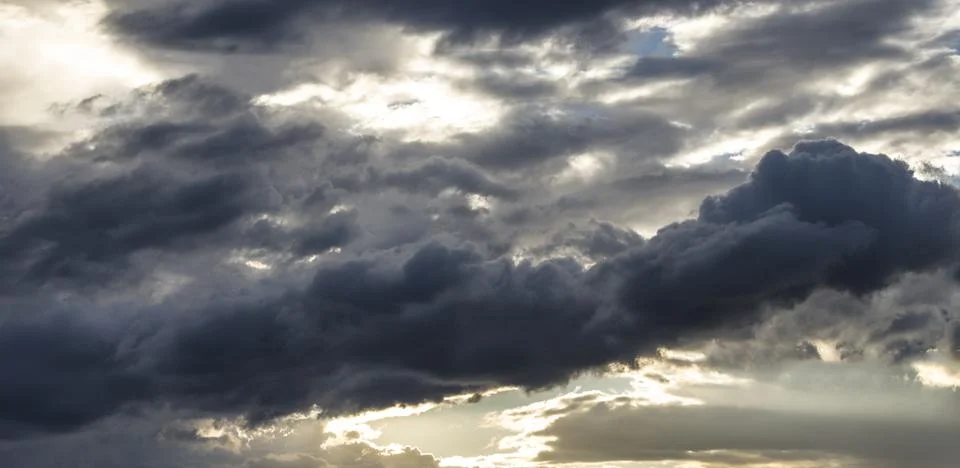 Dramatic sky with dark stormy clouds. Sky background. Stock Photos