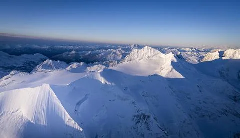 Dramatic sky at dawn on the snowcapped Piz Palu, Bellavista, Piz Zupo and Monte Stock Photos