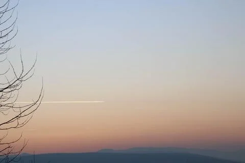 Dramatic sky during sunset and plane Stock Photos