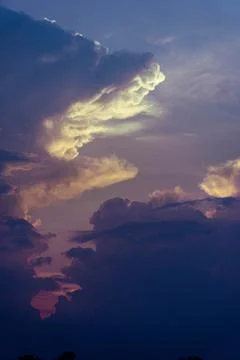 Dramatic sky during the sunset with particularly shaped clouds, in Don Det,.. Stock Photos