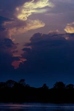 Dramatic sky during the sunset with particularly shaped clouds, in Don Det,.. Stock-Fotos