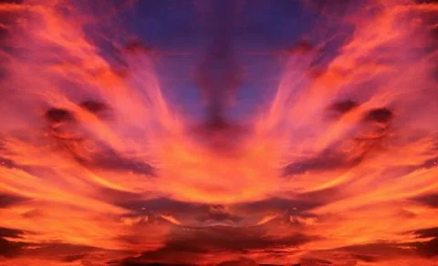 Dramatic sky of expanding clouds in orange Stock Photos