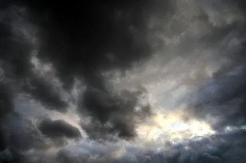 Dramatic sky filled with dark storm clouds before a thunderstorm Stock Photos