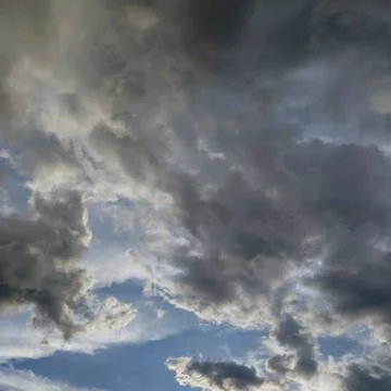 A dramatic sky filled with a mix of thick Stock Photos