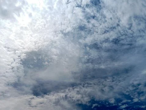 A dramatic sky filled with swirling clouds Stock Photos