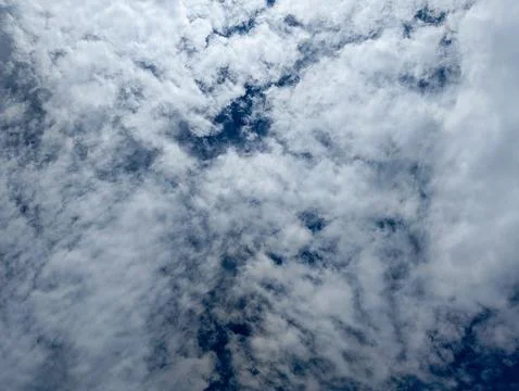 A dramatic sky filled with swirling clouds Stock Photos