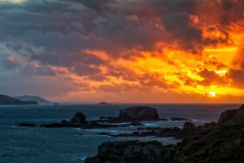 Dramatic Sky of Fire over Miranda Islands at the Mouth of Ares Estuary La Cor Stock Photos
