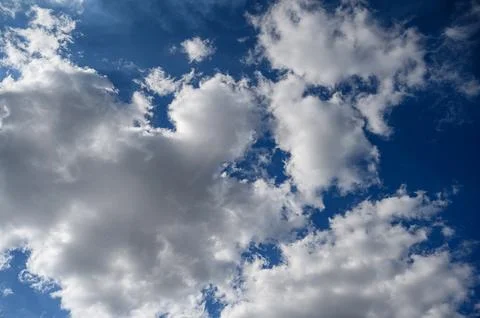 Dramatic Sky with Fluffy Clouds Above Stock Photos