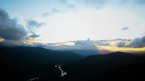 Dramatic sky footage with moving clouds,above the dark forest where the beaut Stock Footage 211598127