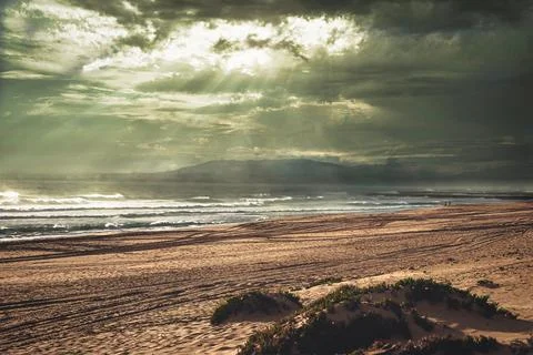 Dramatic sky Golden hour on the beach Fotos de archivo
