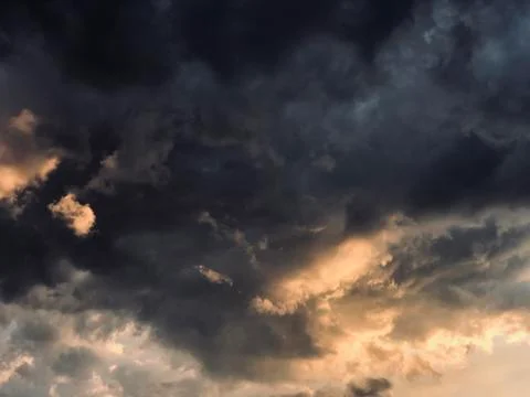 Dramatic sky grey and orange clouds Stock Photos