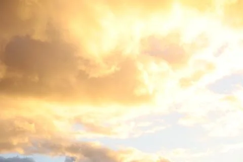 Dramatic Sky with Grey Clouds and Orange Sky around Sunset Time about to Rain Stock Photos