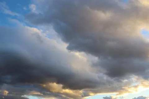Dramatic Sky with Grey Clouds and Orange Sky around Sunset Time Stock Photos