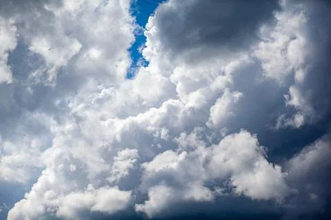 Dramatic sky with grey clouds over the city before the storm. Stock Photos