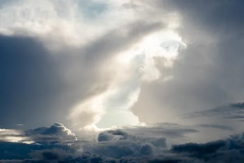 Dramatic sky with grey clouds over the city before the storm. Stock Photos