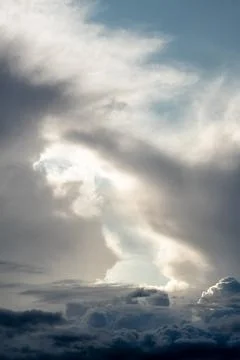 Dramatic sky with grey clouds over the city before the storm. Stock Photos