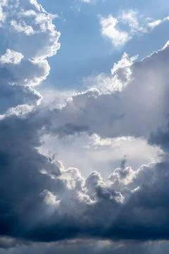 Dramatic sky with grey clouds over the city before the storm. Stock Photos