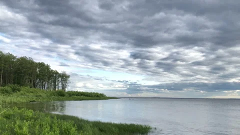 Dramatic sky landscape, low dark clouds over the sea, beautiful summer landscape Stock Footage 259626510