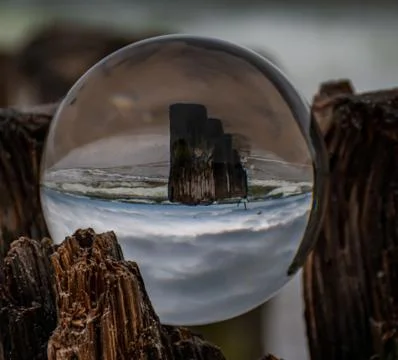 Dramatic sky in a lensball Stock Photos