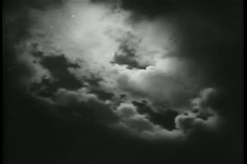 Dramatic sky with moon peeking through clouds Stock Footage 11352601