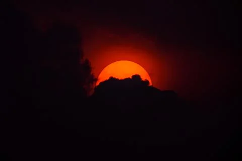 Dramatic sky orange of sun and clouds bright twilight backgrounds. Stock Photos