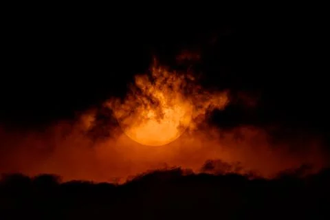 Dramatic sky orange of sun and clouds bright twilight backgrounds. Stock Photos