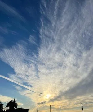 Dramatic Sky Over Ayia Napa, Cyprus, Featuring Wispy Clouds, Golden Sunligh.. Stock Photos