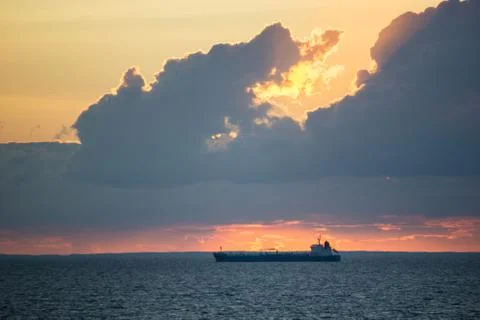 Dramatic sky over the baltic sea with a large ship Stock Photos