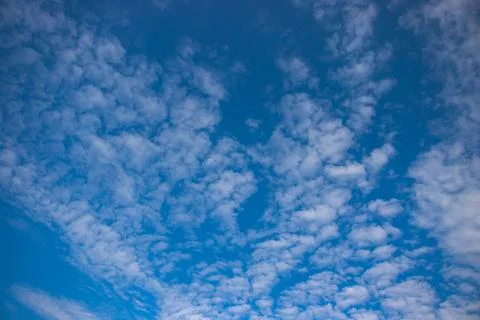 Dramatic Sky over Blue Landscape: Fluffy Clouds in Overcast Weather Stock Photos