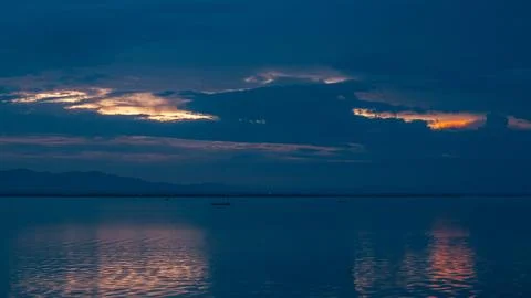 Dramatic Sky over Calm Water at Night Stock Photos