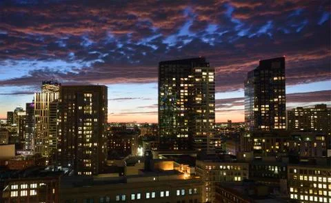 Dramatic sky over city at dusk Stock Photos