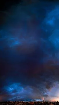 Dramatic Sky Over Cityscape Rainbow 스톡 사진