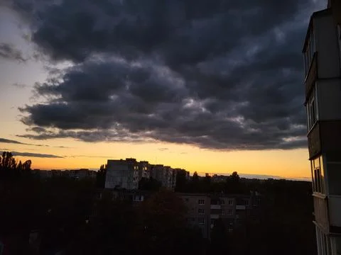 Dramatic sky over the evening city Stock Photos