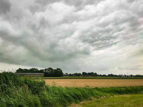 Dramatic sky over the fields Stock Photos
