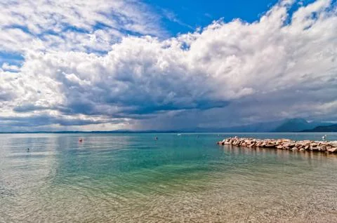 Dramatic sky over Garda lake - Italy Stock Photos