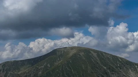 Dramatic Sky Over Mountain Peak Stock Footage 211097032