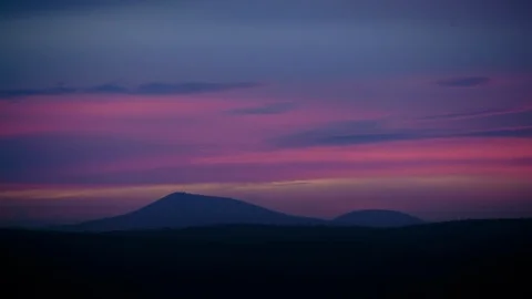 Dramatic sky over mountain ranges and landscape Stock Footage 94882831