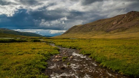 Dramatic sky over mountain river. Timelapse Stock Footage 83914030